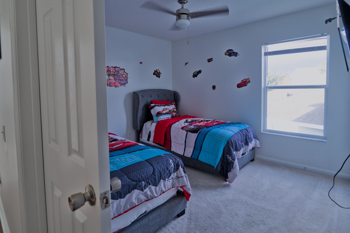 Cars room with two twin beds.