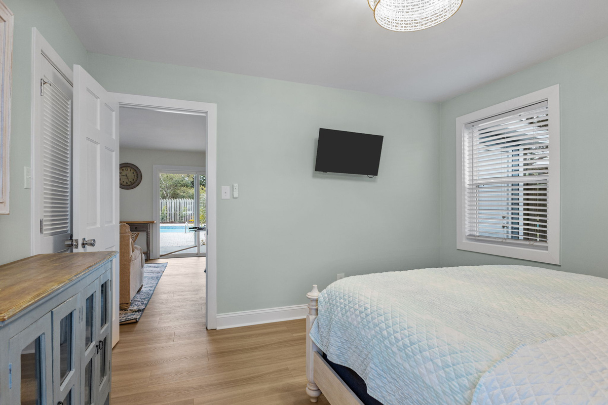 Unwind in your own comfortable retreat with a Smart TV and convenient access to the main living space and pool area