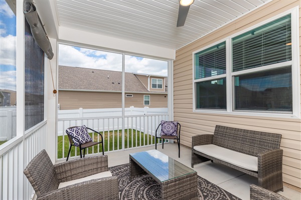 Enjoy some relaxation on the screened-in porch—perfect for morning coffee, evening cocktails, or curling up with a good book while taking in your private backyard view.