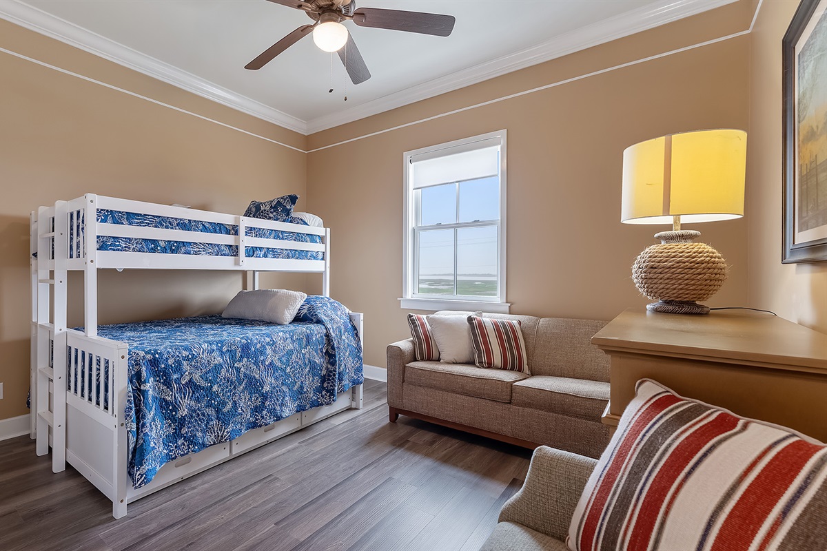 Bunk Room #2: Additional bunk room or reading room with a twin over queen and couches.