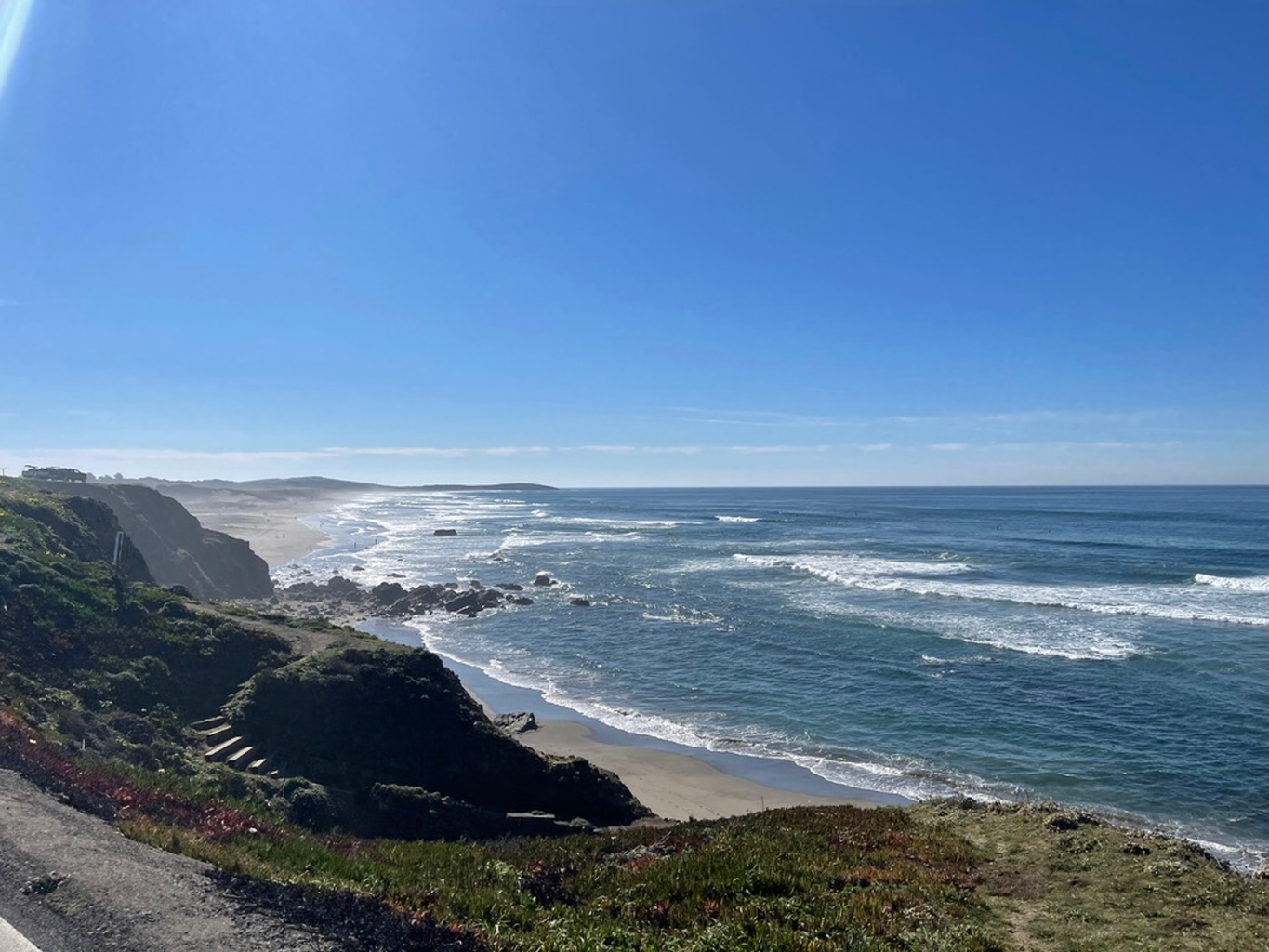 Ocean waves along a rugged coastal bluff