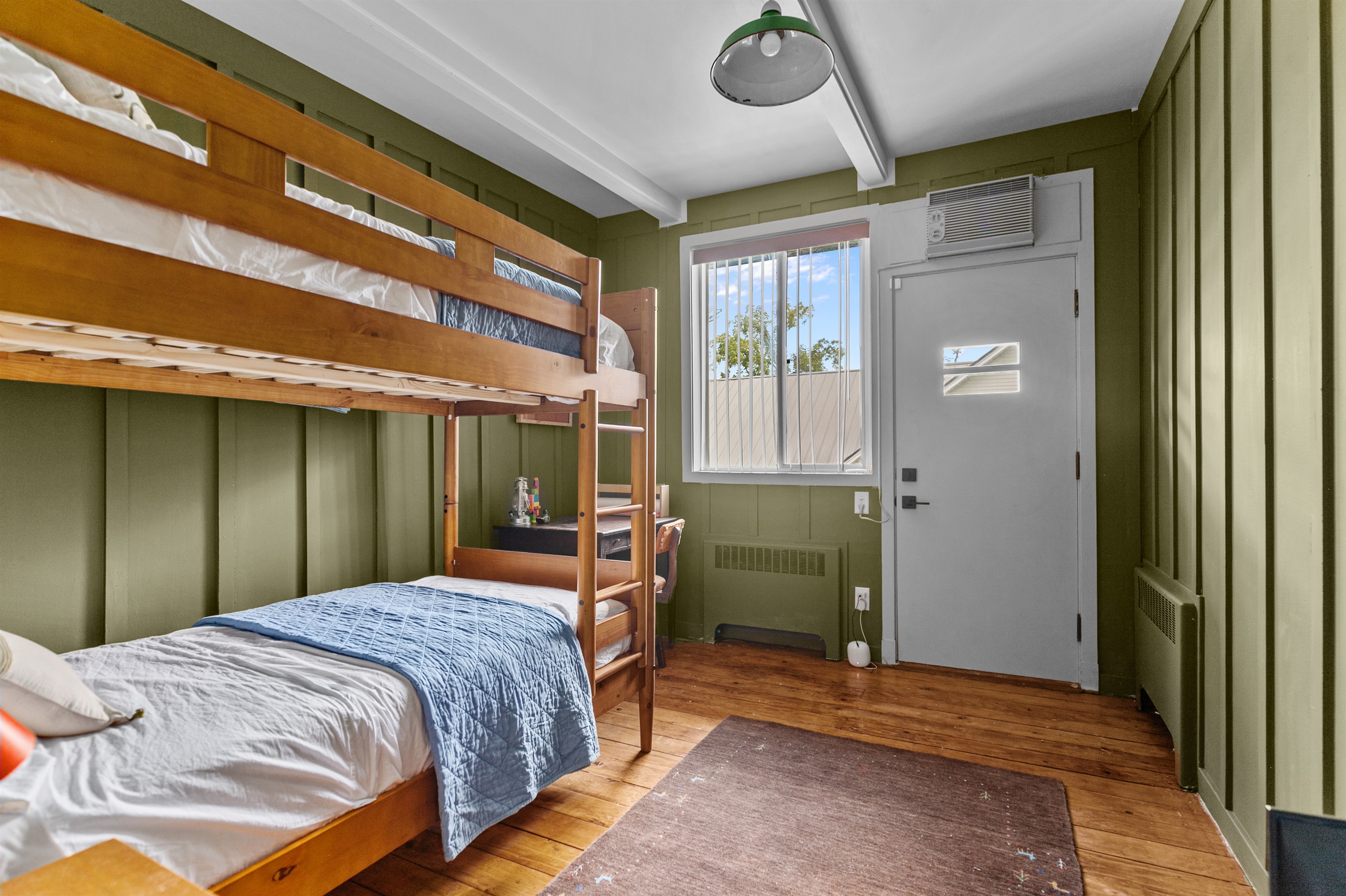 The bunk room features twin-size bunk beds, creating a fun and cozy space for kids or extra guests.