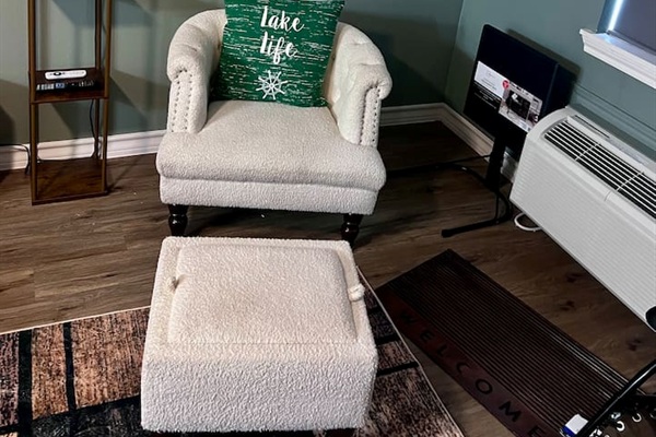 Accent chair with matching ottoman for a small spot to sit back and relax.
