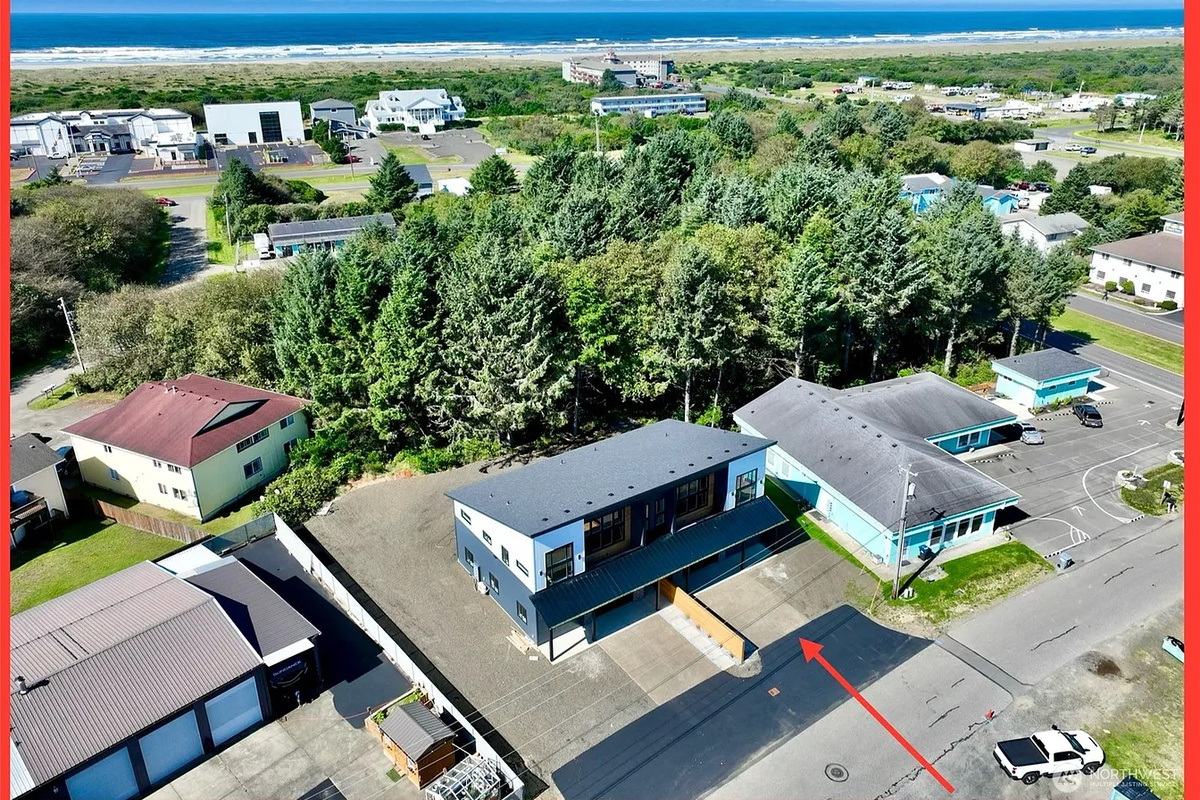 Brand-new 2026 construction with striking modern architecture, tucked into the best part of downtown Ocean Shores. Side A is the half you're booking here; Side B is available too, either on its own or together with this one.