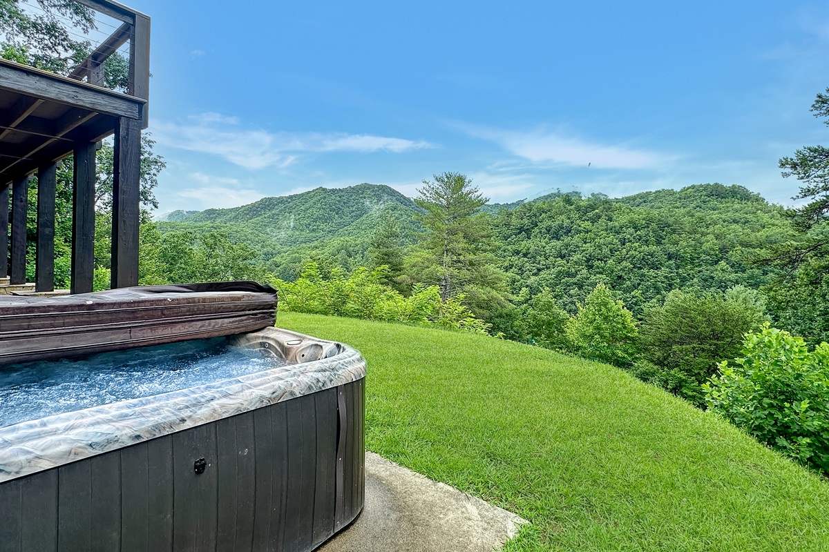 Hot Tub: Unwind in the bubbling hot tub while soaking in breathtaking mountain views!