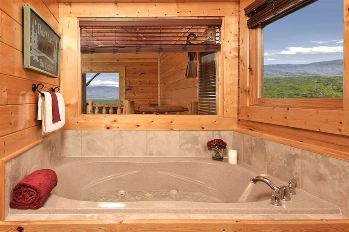 - Relaxing jetted bathtub with wide mountain views from every angle   - Unwind in warmth while gazing out at the stunning Smoky Mountain range   - The ultimate spot for quiet rejuvenation after a day of adventure