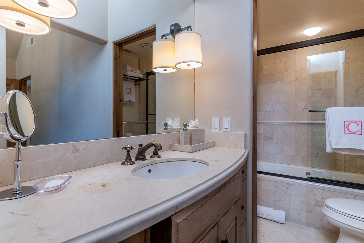 BR 2- En suite bath with glass enclosed shower / tub combo