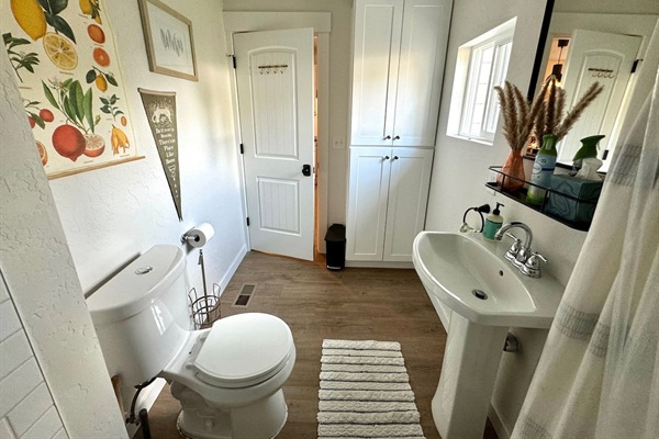 This bathroom off the main floor features a full shower and bath. 