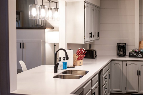 Kitchen features new counters, freshly painted cabinetry, and all new appliances, pot/pans, silverware, etc.