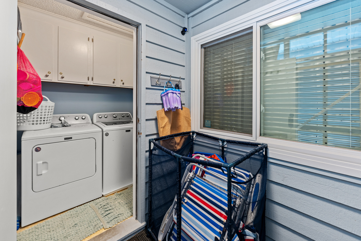 Full size washer-dryer in laundry room