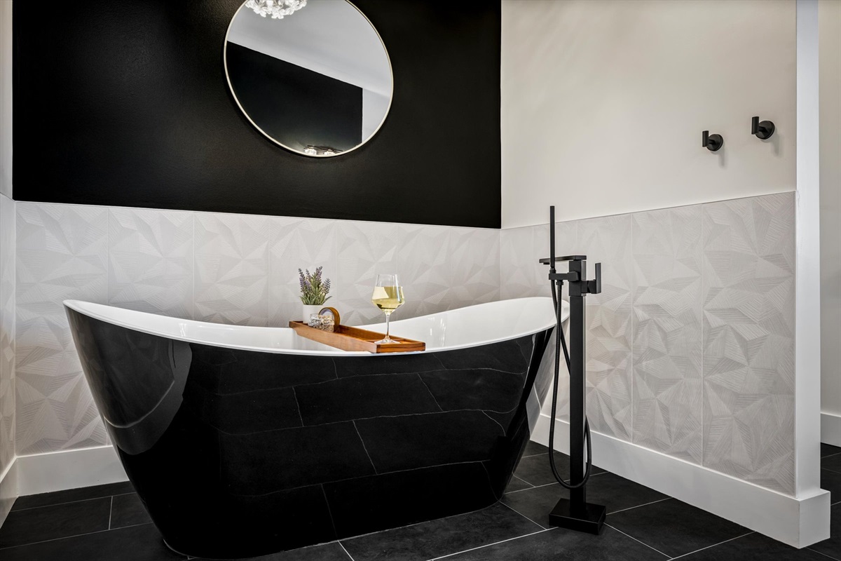 {Master Bath Tub}
Unwind in a deep freestanding soaking tub, complete with bath tray for wine or tea — a spa-like reset designed for slow, intentional evenings.
