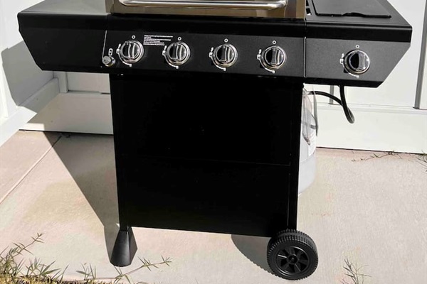 Propane grill with side burner.