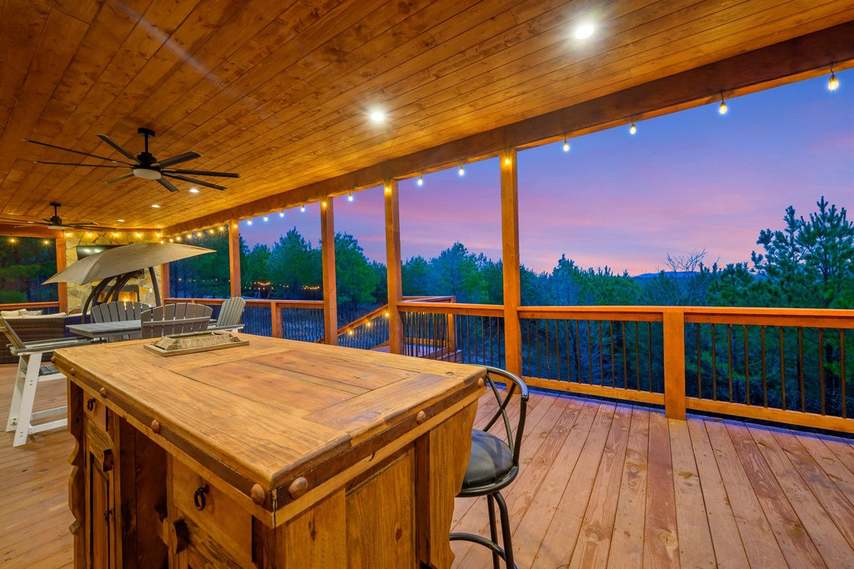 This cabin has double decks with the lower deck being a full wrap around porch.