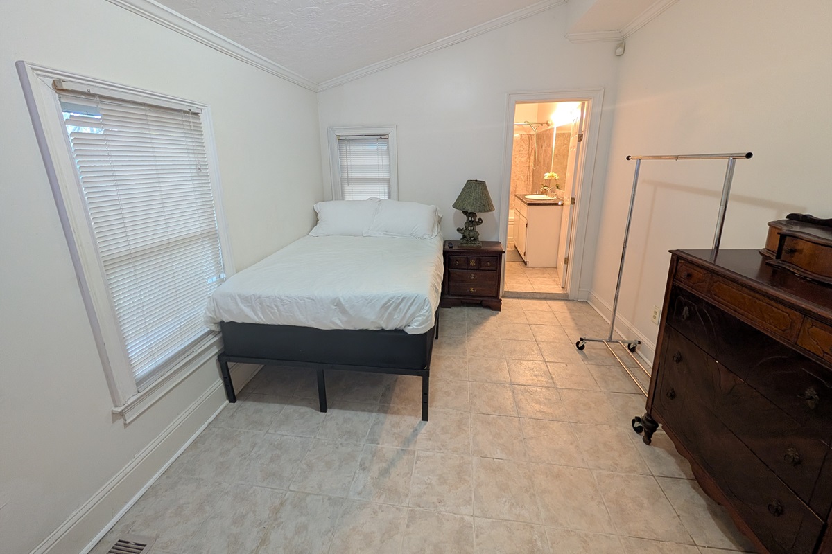 Guest bedroom downstairs with full bed