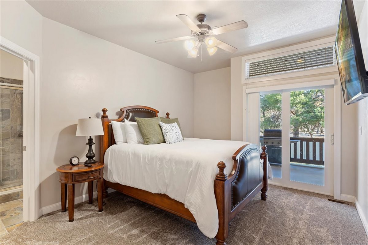 An inviting upstairs primary suite with soft natural light and a private ensuite, creating a tranquil retreat.