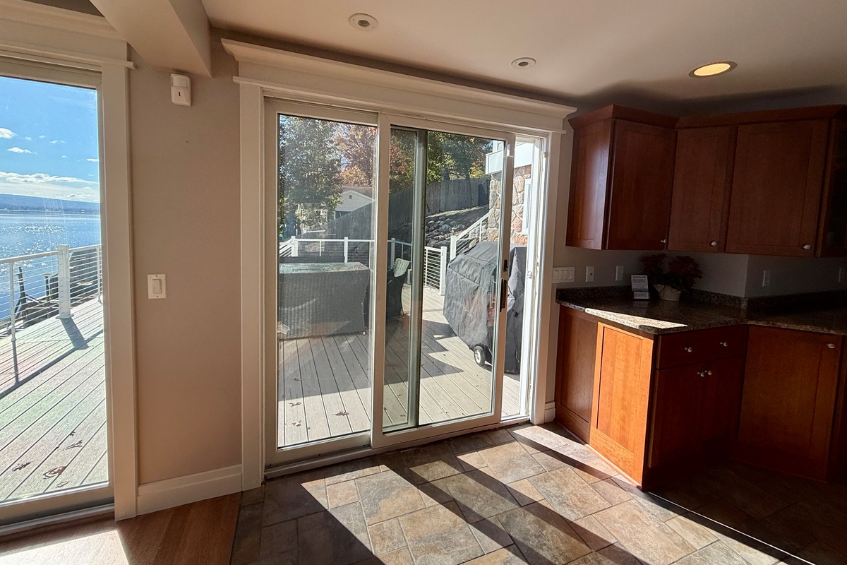 Outdoor table and grill steps from Kitchen