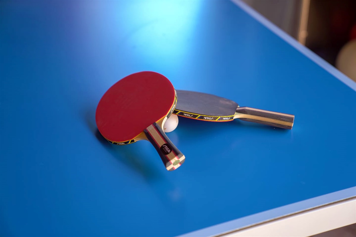 Outside, play ping pong with friends to see who has the better swing.