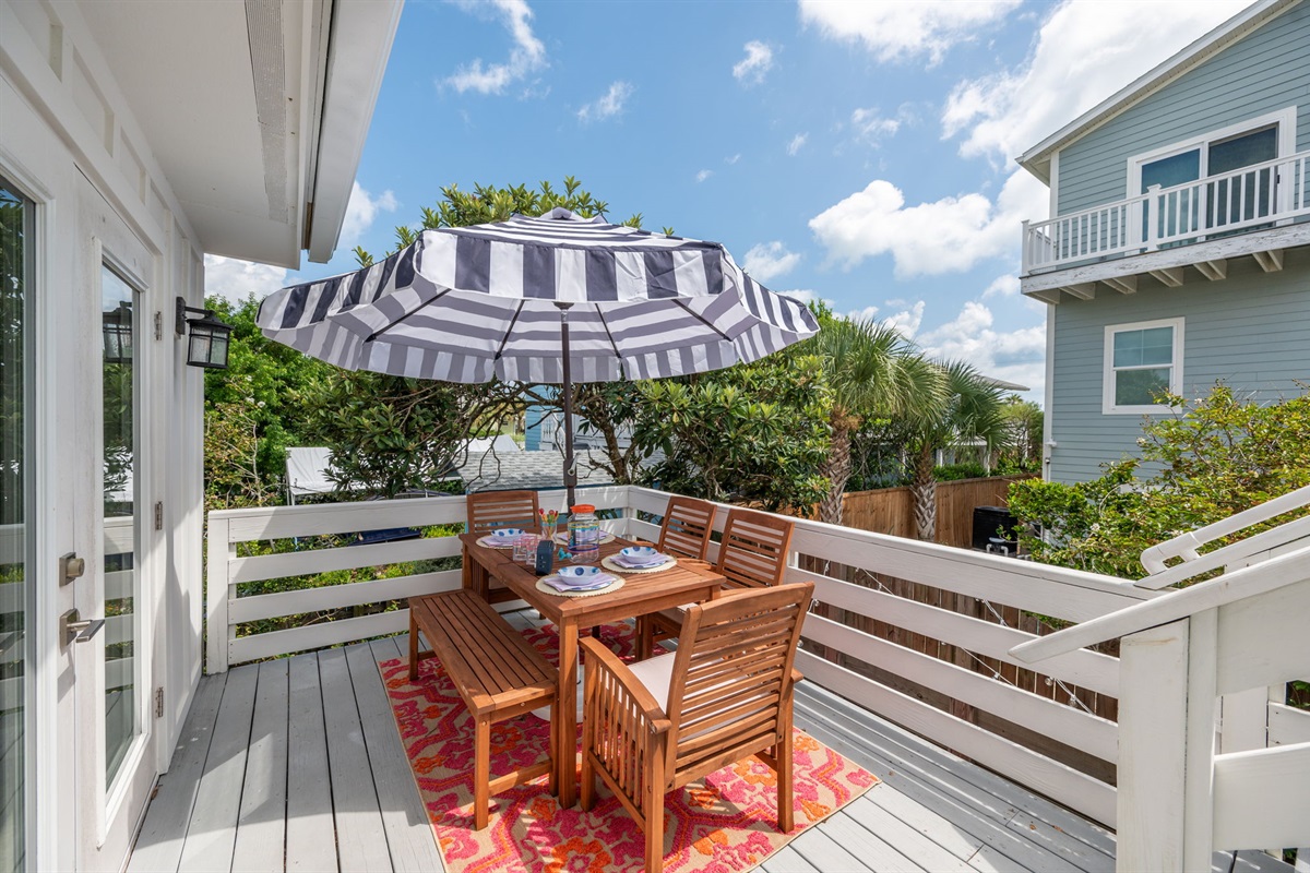 Our spacious outdoor deck, conveniently located off the kitchen, is perfect for dining and lounging. The larger table seats 6-8 (depending on the size of the guests) and comes with an umbrella for sun protection. Plus, there’s a cozy love seat for two and