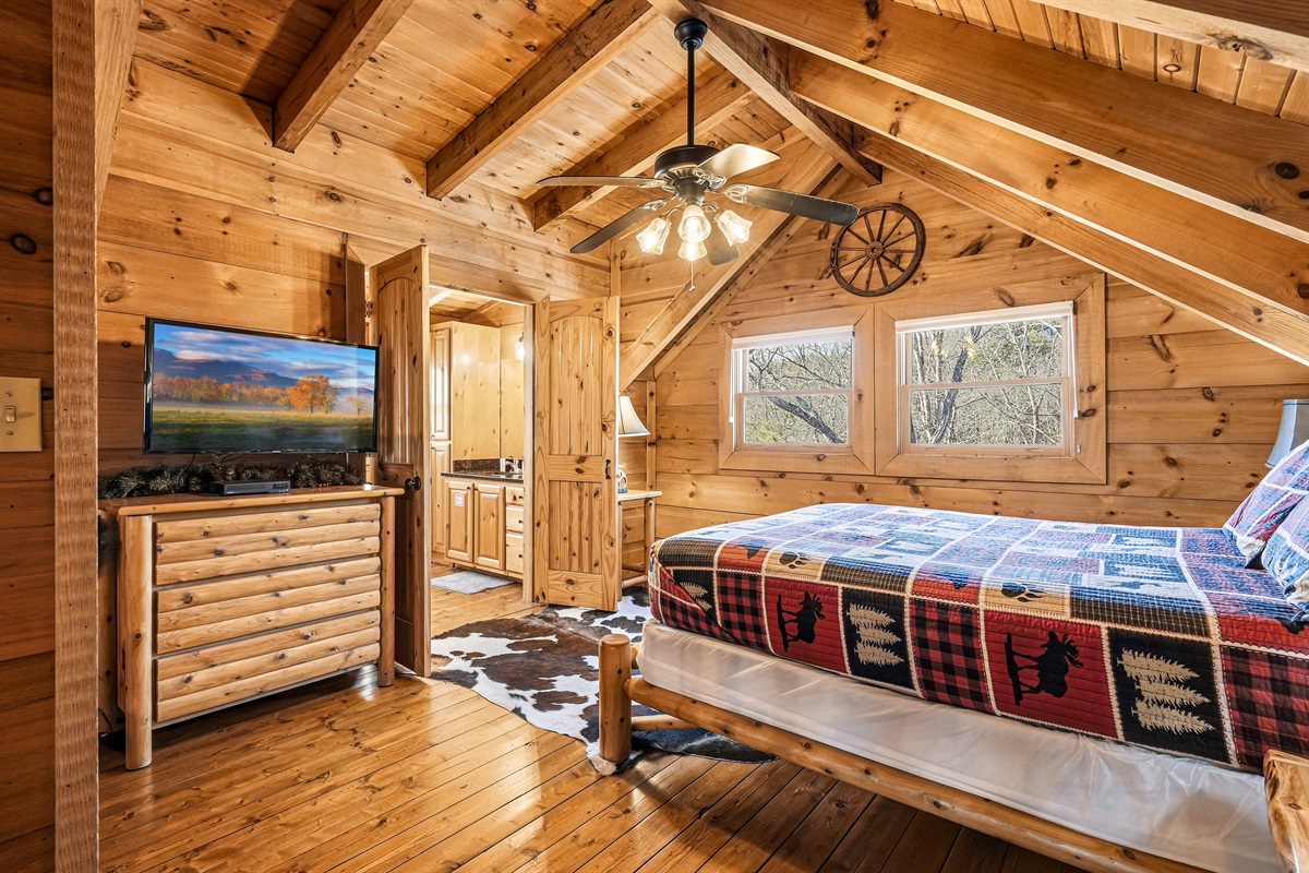Loft area queen size bedroom with attached full size bathroom