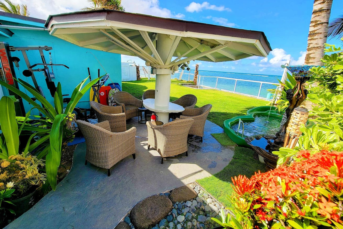 Beachfront Gazebo & Gym with electrical outlets in the center white pillar for your laptops and electronics.To the right is the 7-person beachfront jacuzzi with 2 outdoor showers and surround sound outdoor bluetooth tower speakers that are waterproo