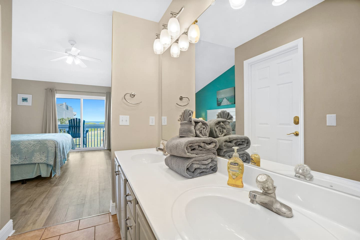 Get ready side by side at the double sink &mdash; the large mirror makes mornings feel easy and unrushed.