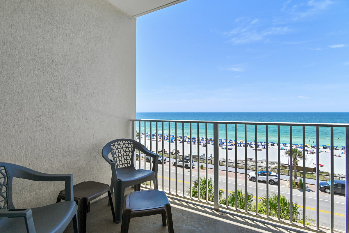 Spacious patio with plenty of seating, perfect for soaking in those Emerald Coast Views - accessible from the living room 