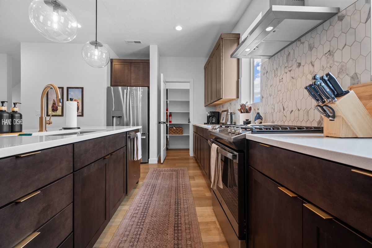 Sleek kitchen layout with ample counter space and high-end finishes.
