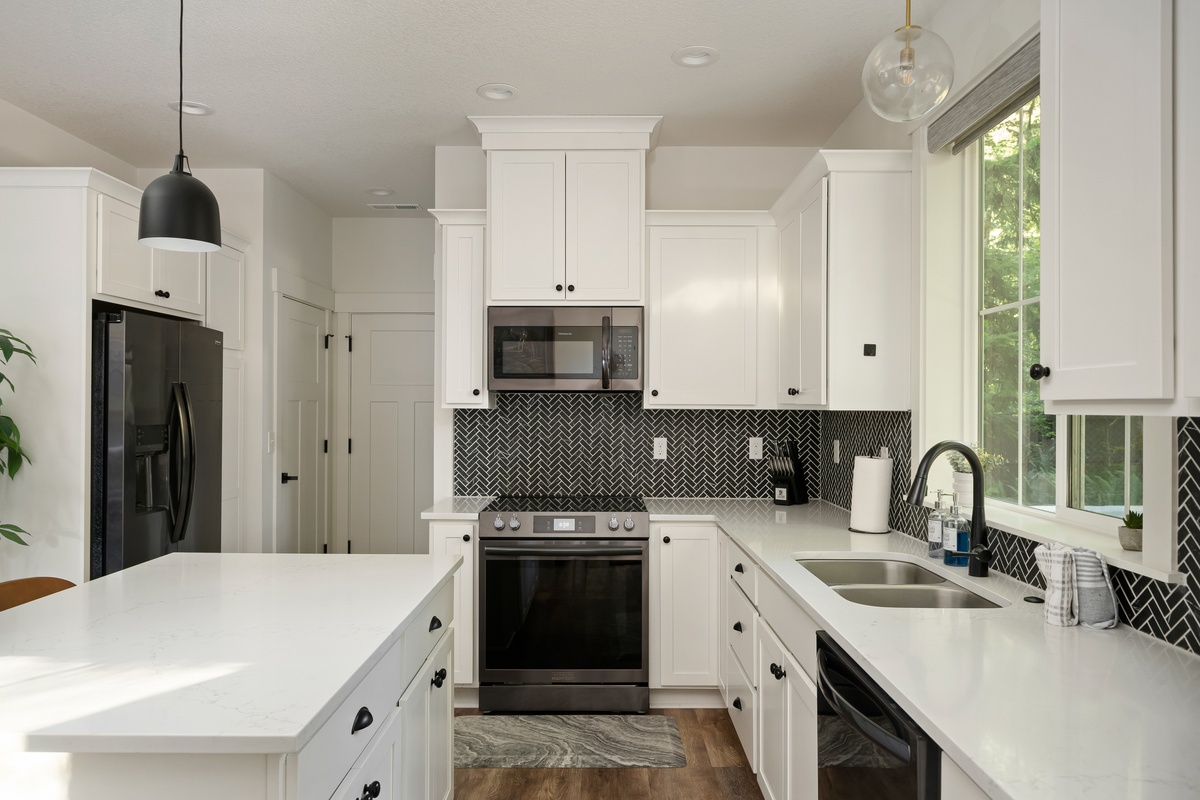 A chef-ready kitchen with quartz counters and herringbone tile, made for cooking up mountain memories.