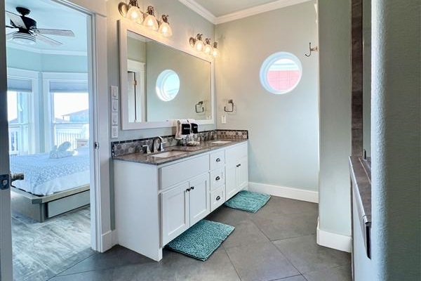 Crystal Paradise Bathroom 3: Stylish vanities with spacious countertops and well-lit mirrors make freshening up a breeze.