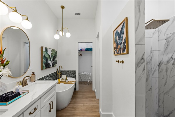 Palms of Grand Galvez luxurious bathroom. Large shower, soaking tub, double vanity, closet.