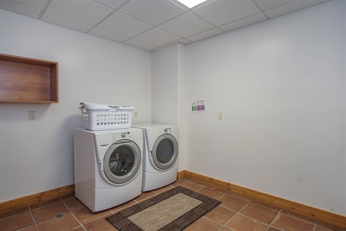 Lower Level laundry room with washer and dryer for added convenience