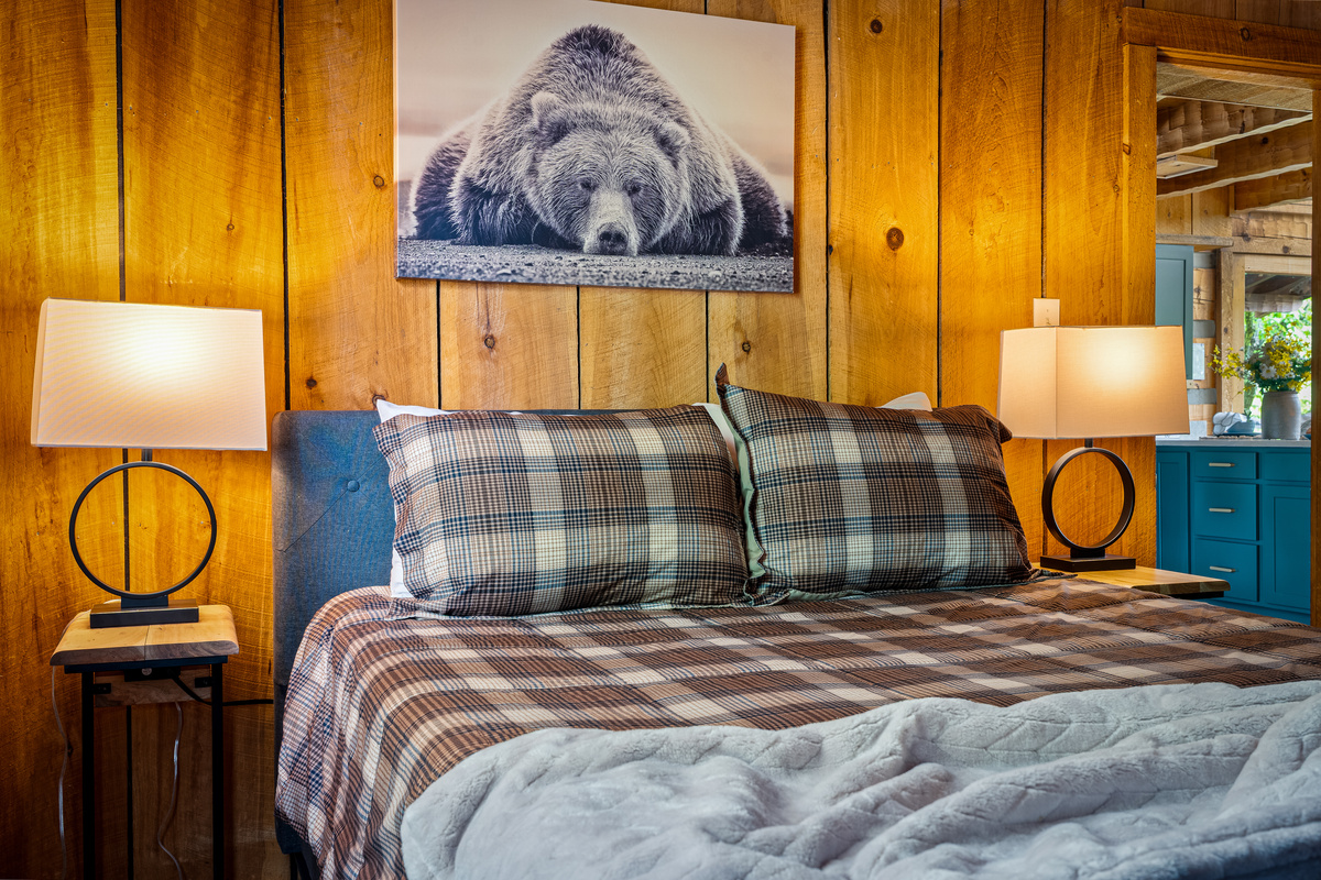 Queen bed and quilt in the main level family room