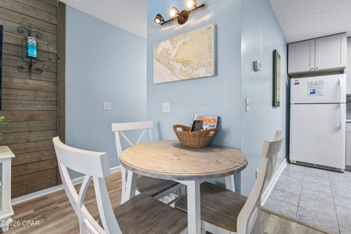 Enjoy home-cooked meals with an open kitchen and dining space, making it easy to gather together after a fun day at the beach.