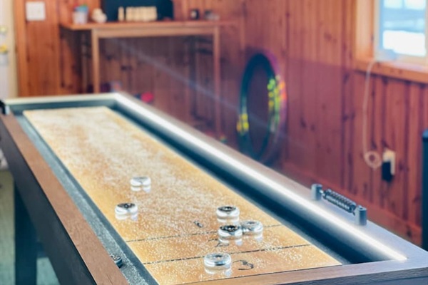 Shuffleboard table for fun indoor entertainment.