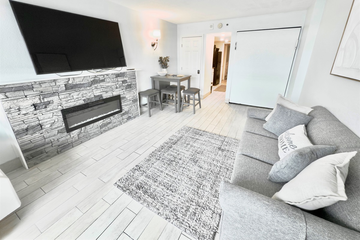 Living room with sofa bed and Murphy bed