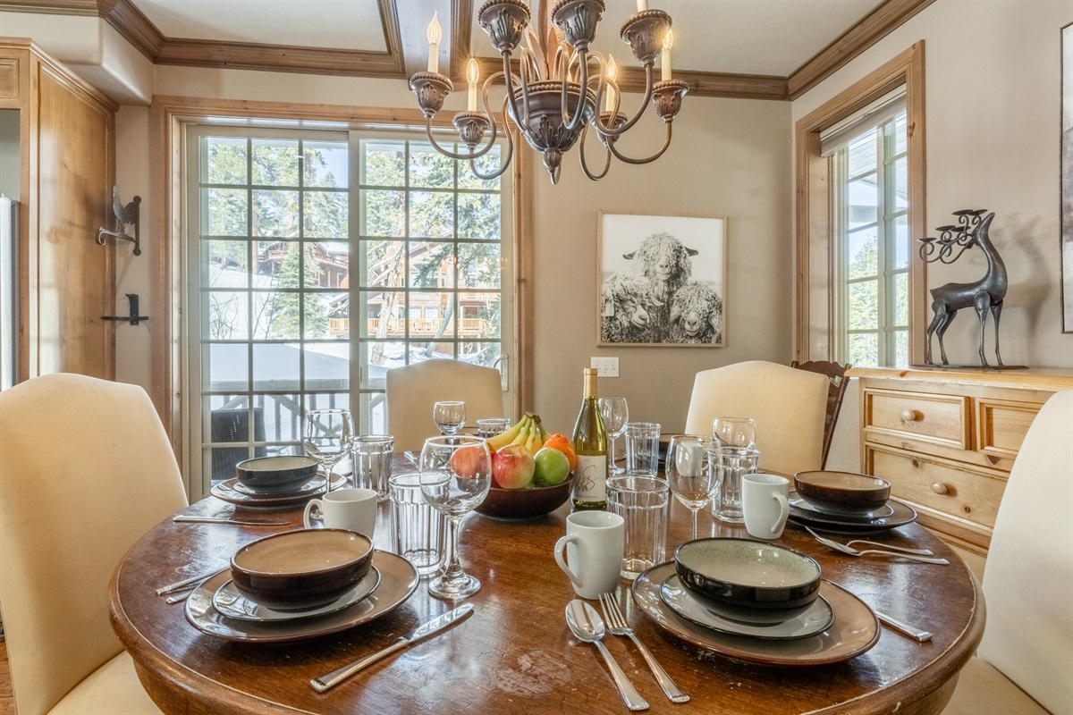 A light-filled dining space with a large sliding window leading to the Nest's Juliet balcony—perfect for morning coffee, fresh air, or a tucked-away workspace.