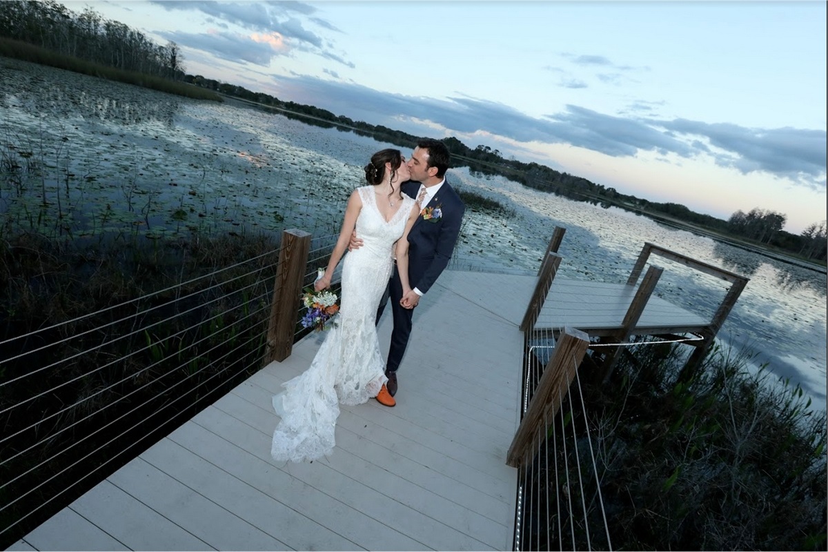 Dockside wedding moment at Lake Walsh Clermont retreat