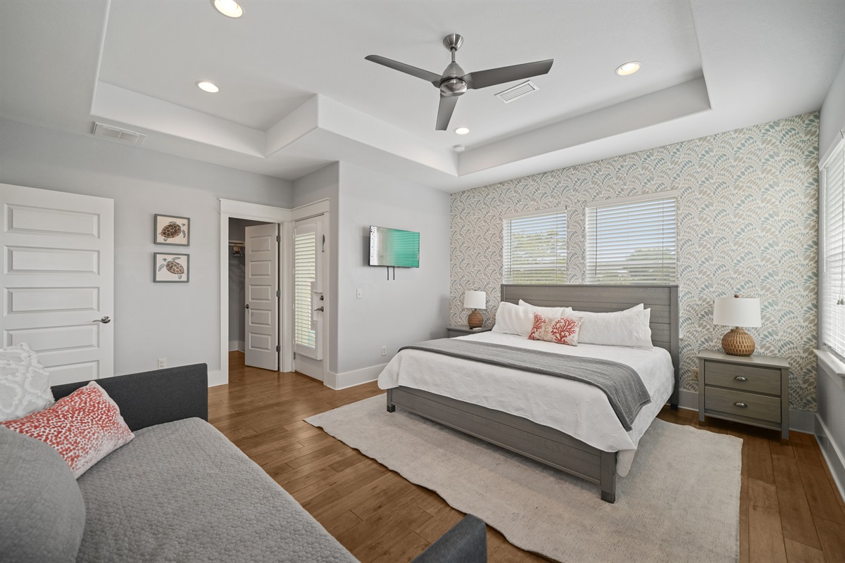 Elegant Grand Master King Suite with ensuite bath, twin daybed, and large walk-in closet.