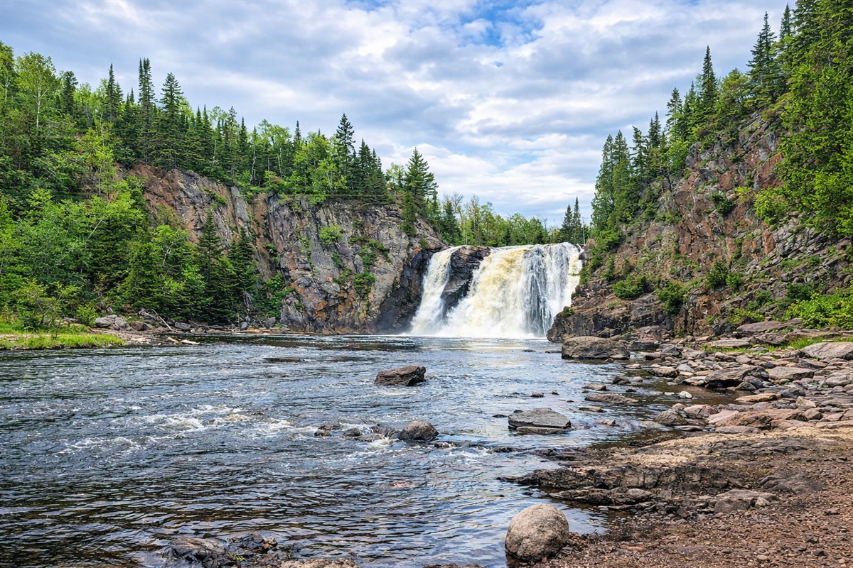 High Falls at Tettegouche State Park, Spring runoff brings this powerful waterfall to life, framed by lush green foliage and dramatic cliffs. A must-see North Shore highlight just 8 minutes from the cabin and an unforgettable adventure.