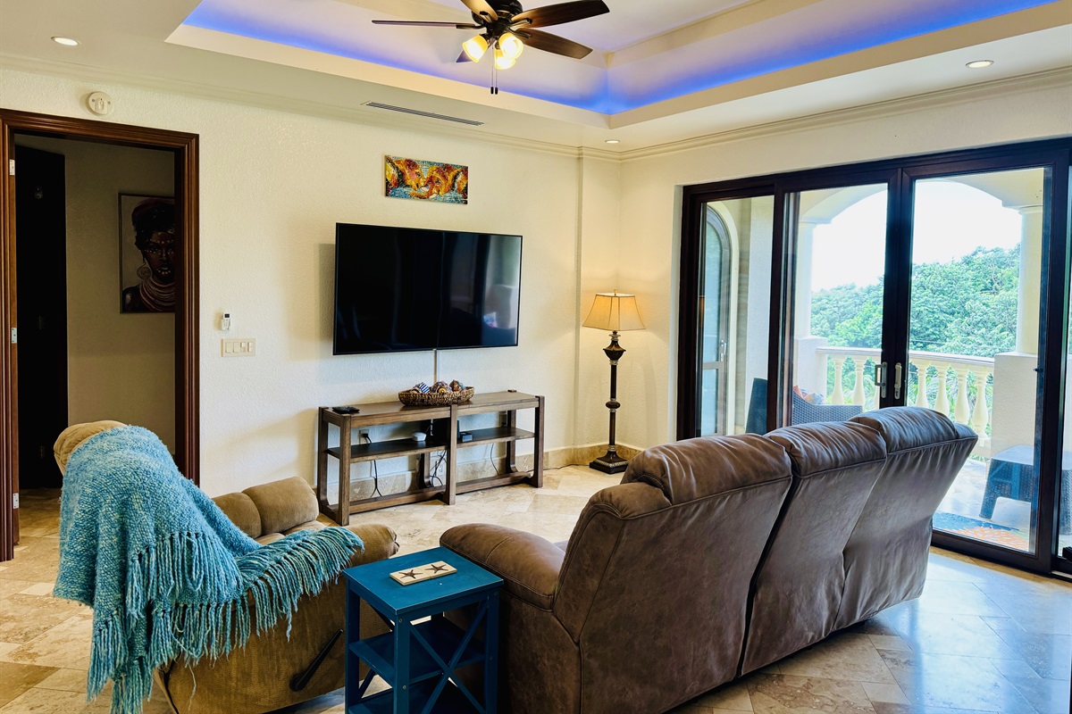 70" Smart TV with Amazon fire stick. 3 reclining seats for you to kick back and relax after a day spent exploring Roatan.