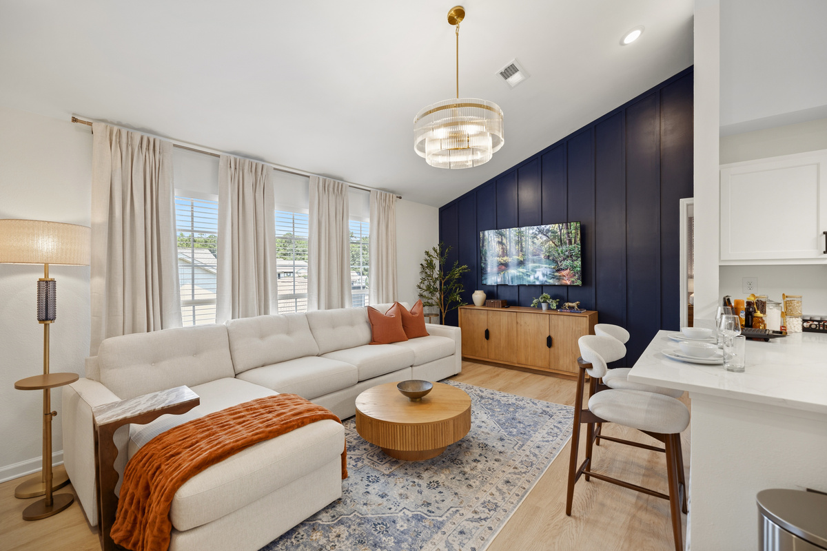 Land here first — sink into the sectional under the vaulted ceiling and let all seven of you spread from the couch to the breakfast bar without anyone fighting for a seat.