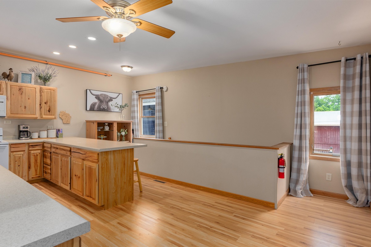 Raindrop's large kitchen flows into the living room, then down a small hallway to the rest room.