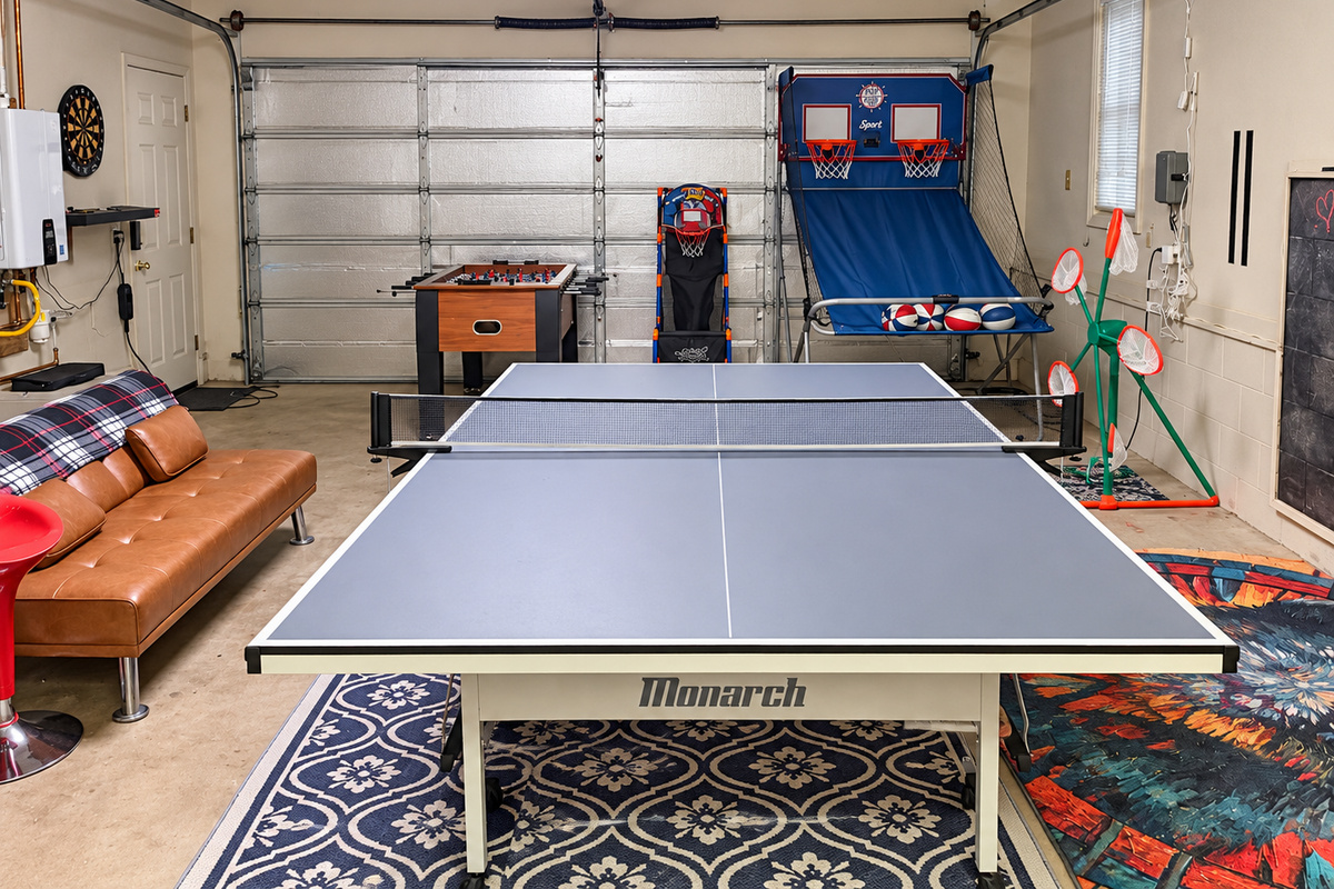 Game room with ping pong, foosball, arcade games, TV, and plenty of space for group fun.