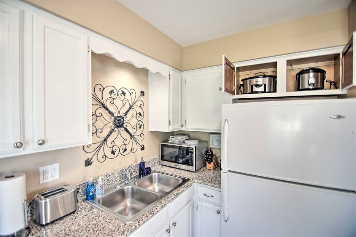 3Bd Unit:  The kitchen is fully stocked with all the modern appliances an oven, dishwasher, refrigerator with ice maker, stainless steel microwave, toaster, slow cooker, rice cooker, air fryer and blender. Dishes, glasses and utensils are available.