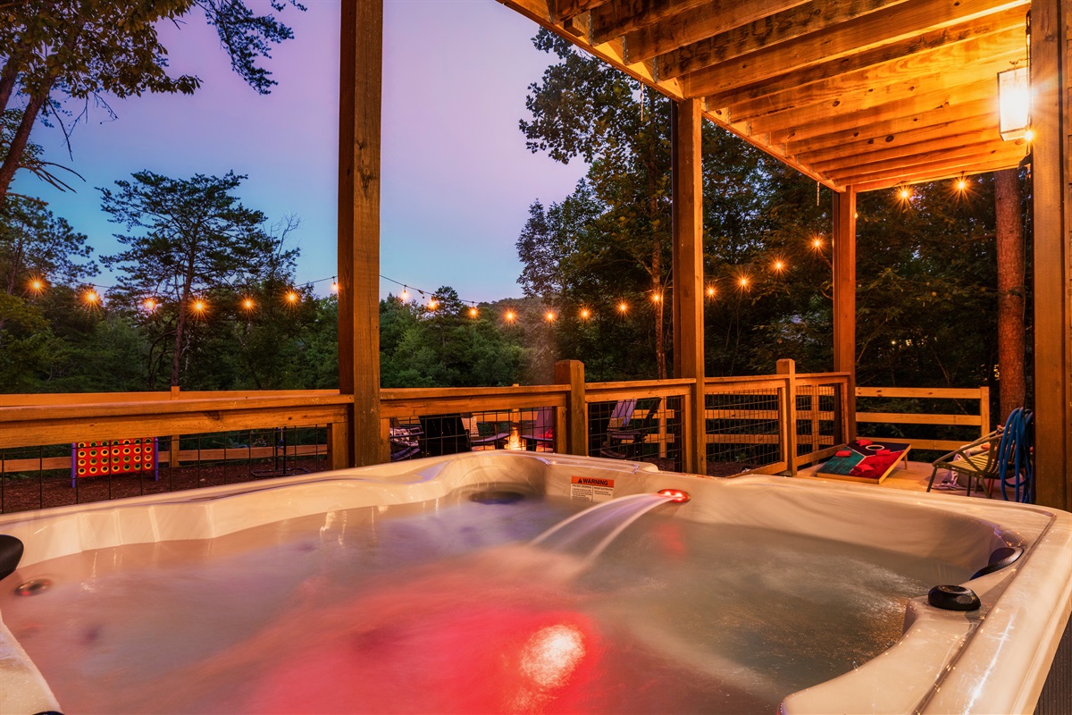 Soak in the hot tub with backyard views