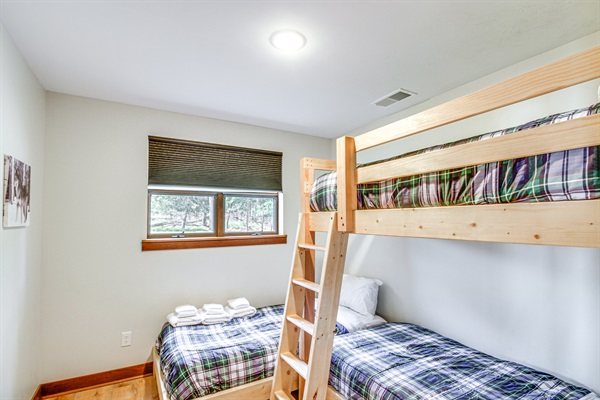 Family-friendly bunk room featuring twin-over-twin bunks and natural light—perfect for kids or extra guests.