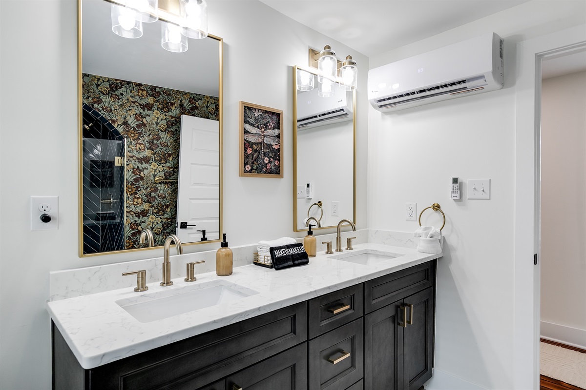 Luxurious Bathroom: Experience elegance with dual sinks, chic decor, and modern fixtures!