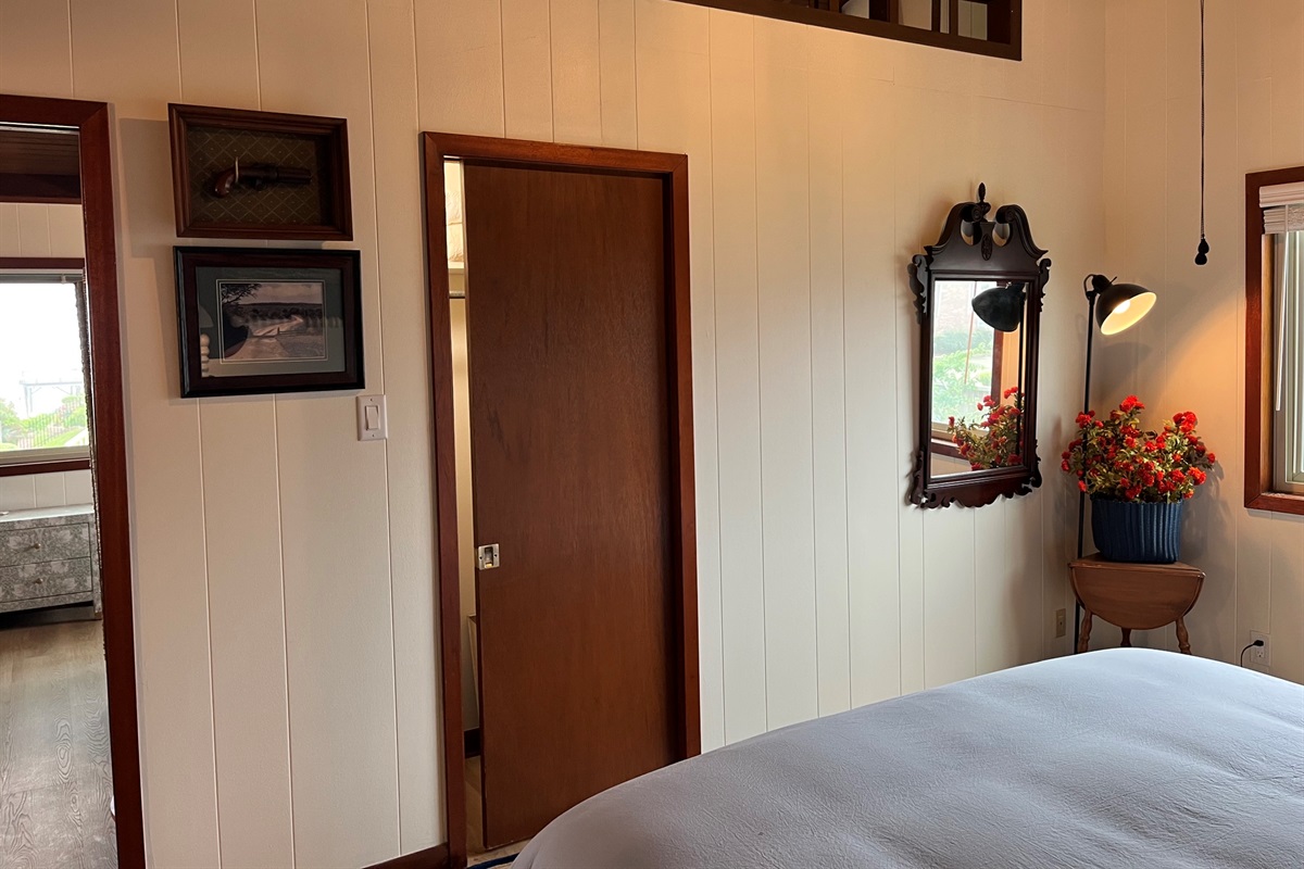 Master bedroom with king size bed and closet
