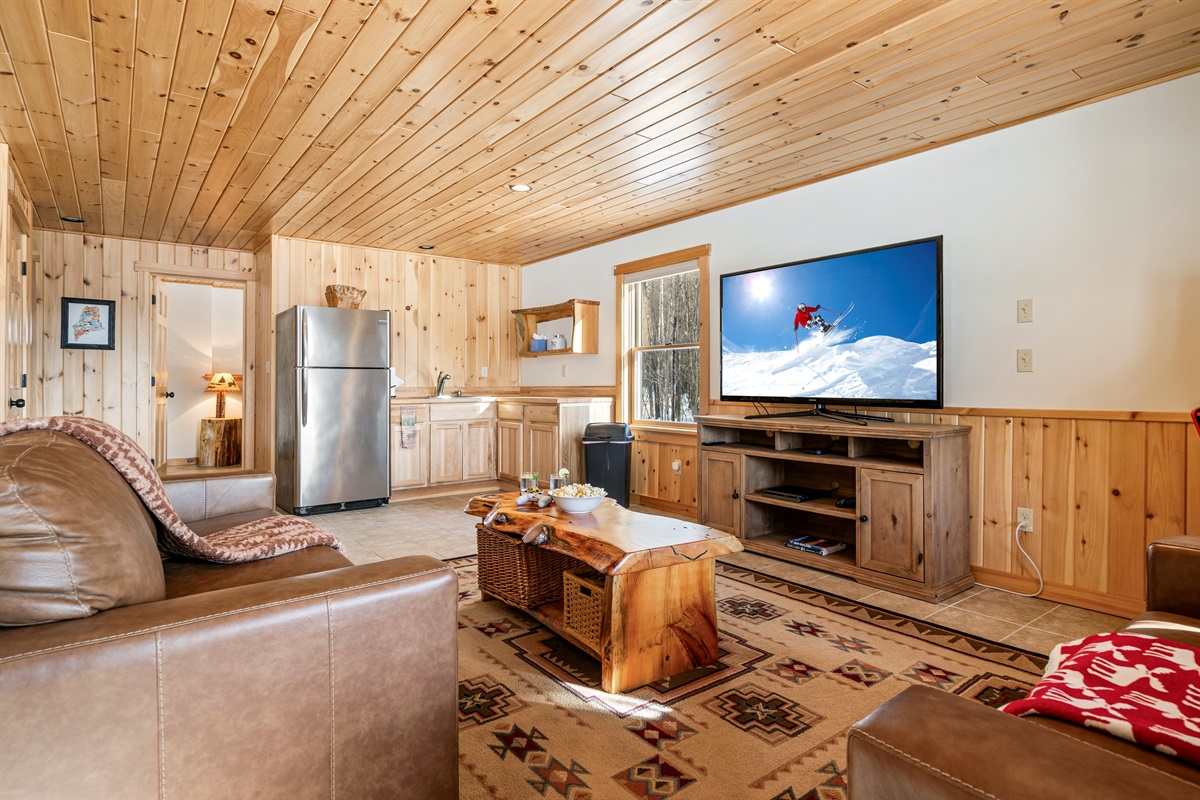 Lounge in comfort with extra space and a handy fridge nearby.