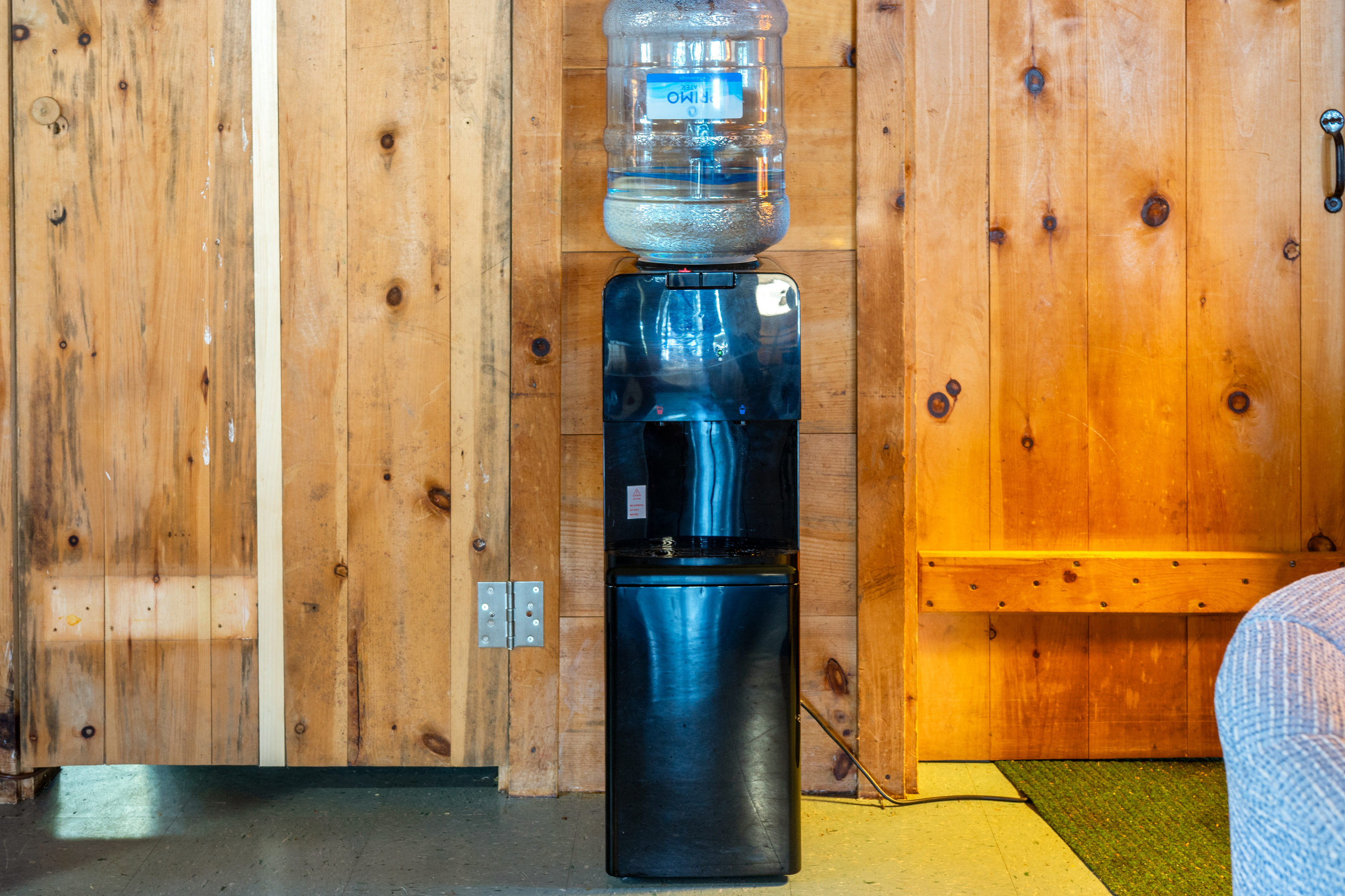 Drinking water dispenser at Loonrise Point! Taps & bathroom use lake-fed water, so a Primo dispenser is provided with fresh, clean drinking water for your stay. Thoughtful comfort at our seasonal camp on Beech Hill Pond in Otis, ME.